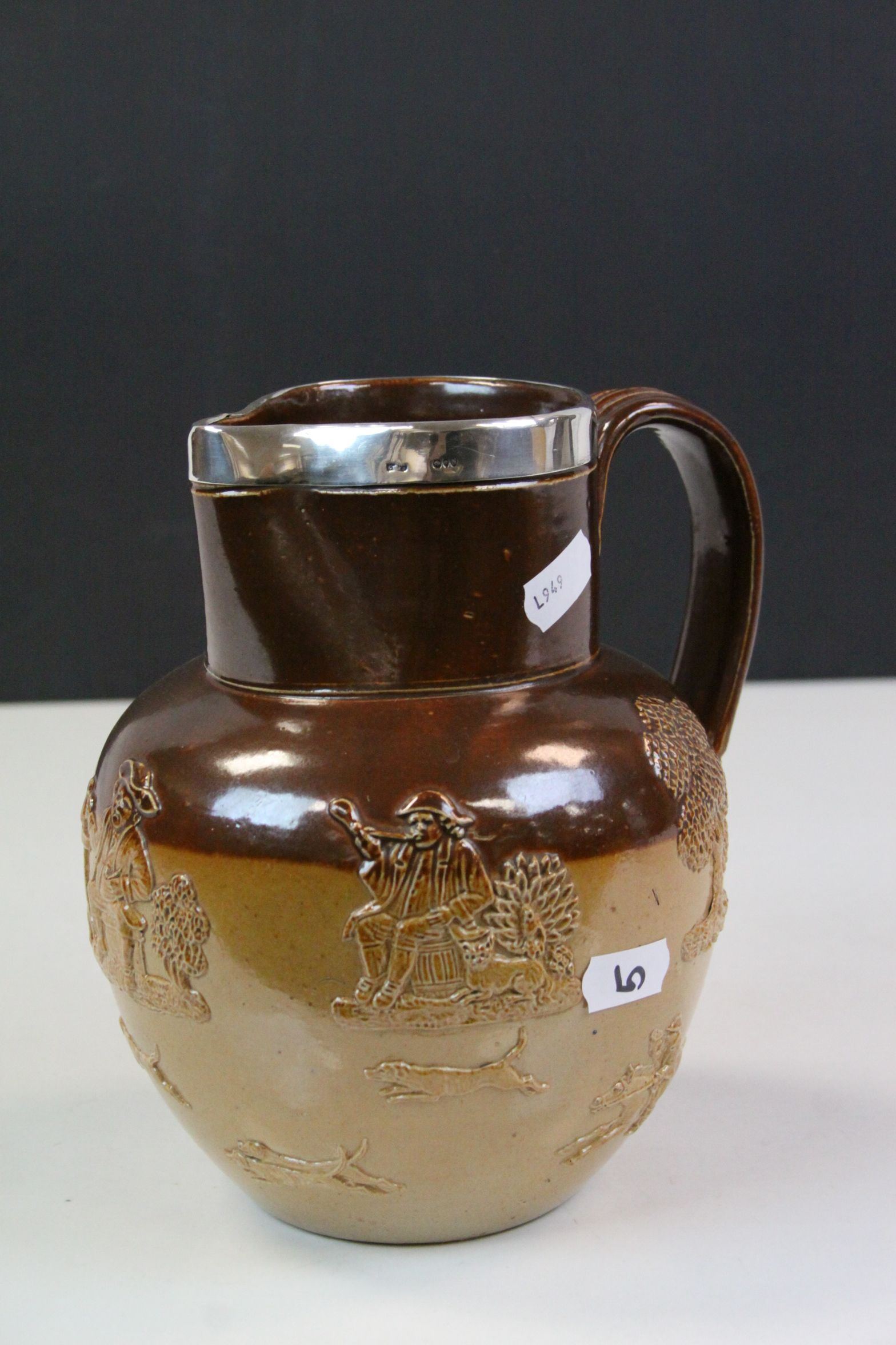 19th Century Doutlon Lambeth stoneware Harvest pattern Jug with Hallmarked Silver rim, stands approx