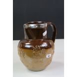 19th Century Doutlon Lambeth stoneware Harvest pattern Jug with Hallmarked Silver rim, stands approx