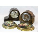 Pair of floral decorated oval wall plaques and two mid 20th century oak cased mantle clocks