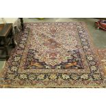 Blue, Red and Cream Ground Rug with a pattern of stylised foliage and birds, 213cms x 149cms