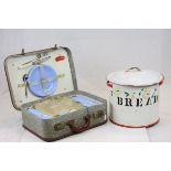 Mid 20th Century enamel bread bin, together with a cased picnic set