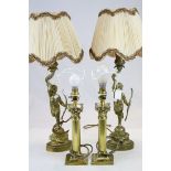 A pair of figurative brass gilt table lamps with shaped shades, together with a pair of contemporary