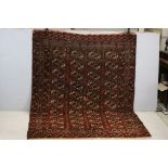 Turkmen Bukhara Red Ground Wool Rug, 200cms x 155cms
