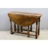 Oak Gate-leg Table raised on Turned Baluster and Block Supports, 107cms wide x 73cms high