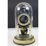 Glass dome covered Anniversary type Clock with Zodiac dial & World Globe pendulum by Kaiser, stands