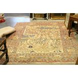 Cream and Orange Ground Rug, the central panel with a scene of Birds and Animals within Trees and