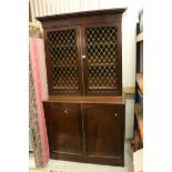 19th century Mahogany Bookcase / Cupboard, the upper section with Pierced Gilt Metal Panels to doors