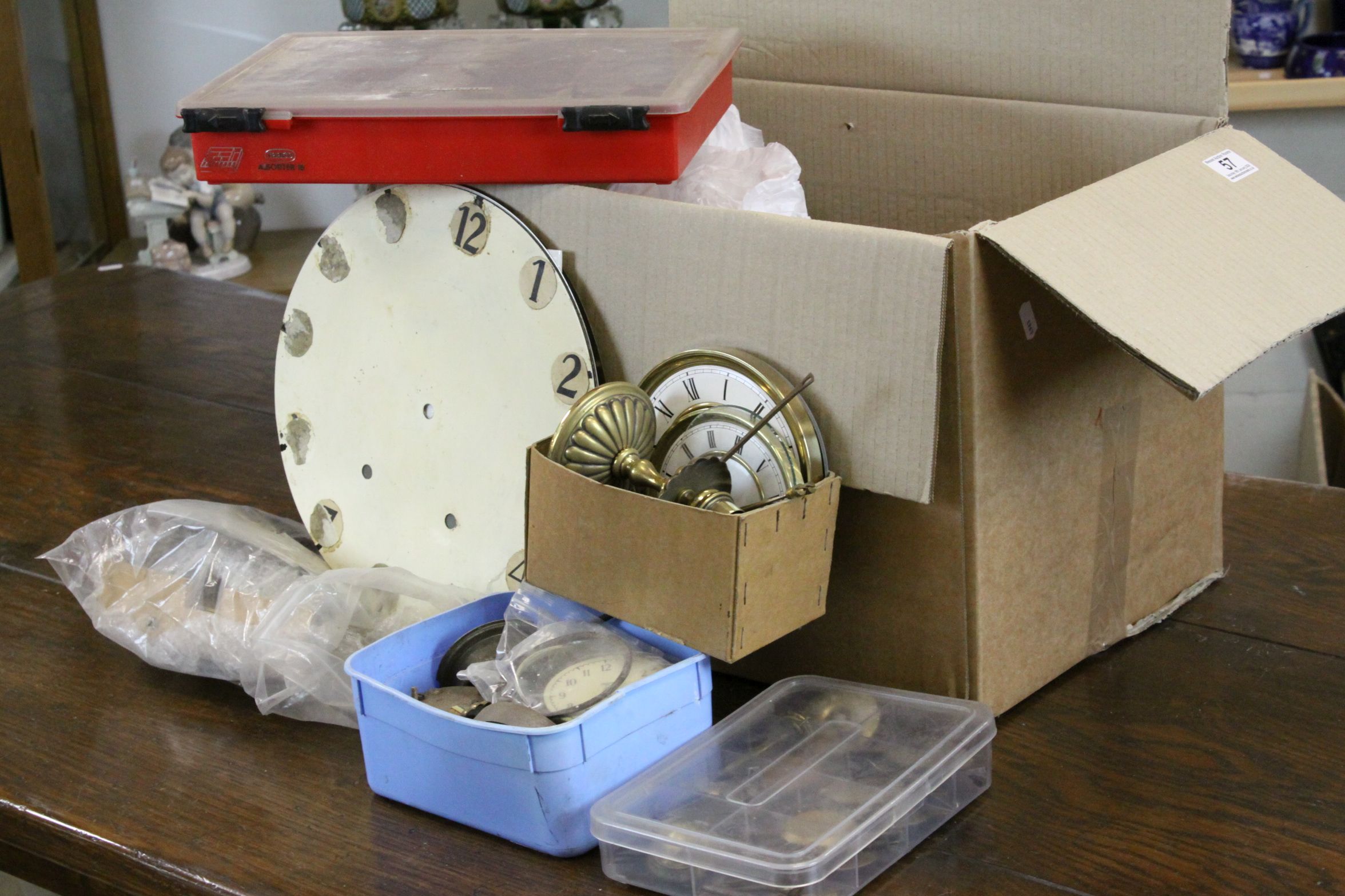Large box of mixed vintage Clock parts to include Dials, Pendulums, Glasses & Hands etc