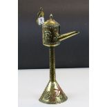 Antique brass continental ceremonial anointing oil vessel with lion mask and scrolling copper