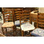 Four Oak Ladder Back Chairs, each with a different stuff-over Needlework Seat