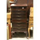 Early 20th century Mahogany Music Cabinet of Eight Drawers raised on Short Cabriole Legs, 53cms wide