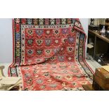 Kilim Style Wool Rug, Red Ground with a Black Border and Stylised Pattern, 312cms x 202cms