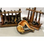 Two wooden pipe racks, one modelled as an anchor, plus a collection of pipes to include Peterson &