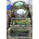 Two pairs of composite stone garden planters, three other similar trough shaped planters, one