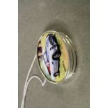 Silver and enamel lidded pill box with Aston Martin image