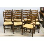 Eight Oak Ladder Back Dining Chairs with Rush Seats (including two carvers)