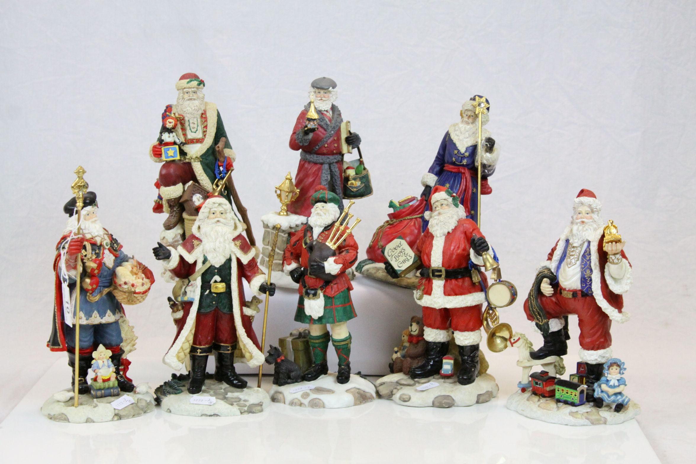 Hamilton Collection set of eight figures from the "International Santa" collection, accented with