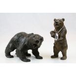 Two carved Wooden Black forest bears, the standing one approx 21.5cm tall with Glass eyes and