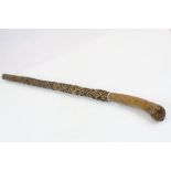 Tribal carved wooden stick with inscription