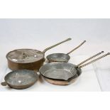Three copper graduation frying pans, a lidded pan and one other