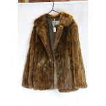 Vintage red squirrel fur coat with Ross Furriers of Leeds label, hook and eye fastenings, two