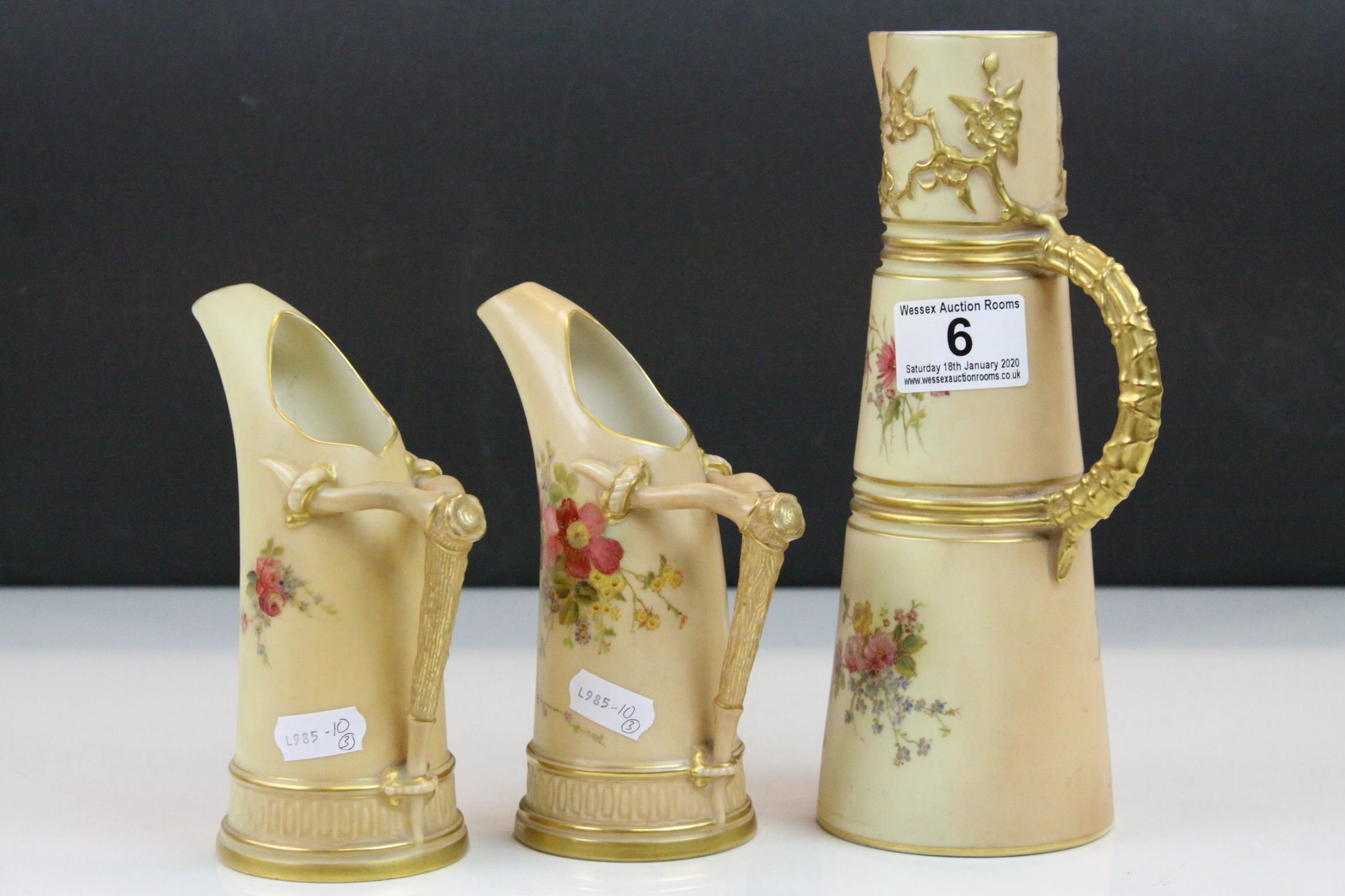 Three Royal Worcester Blush Ivory ceramic Ewers all with hand painted Floral designs & Gilt