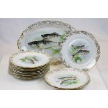 Set of 12 Veritable porcelain cabinet plates decorated with fish in a naturalistic setting