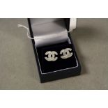 Pair of silver and CZ designer style stud earrings