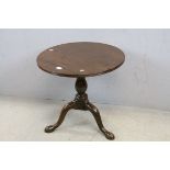 19th century Mahogany Low Circular Tilt Top Table raised on a Pedestal Column and Three Swept