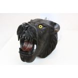 Carved wooden Lioness head with glass eyes & stained finish, measures approx 23 x 22 x 21.5cm at the