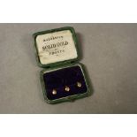 Vintage Stud box containing three Hallmarked 9ct Gold Studs