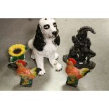 Three painted Cast Iron Door stops, a 19th Century Door stop modelled as Mr Punch plus a Plaster