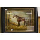 Ebonised framed oil painting of a thoroughbred horse in a stable