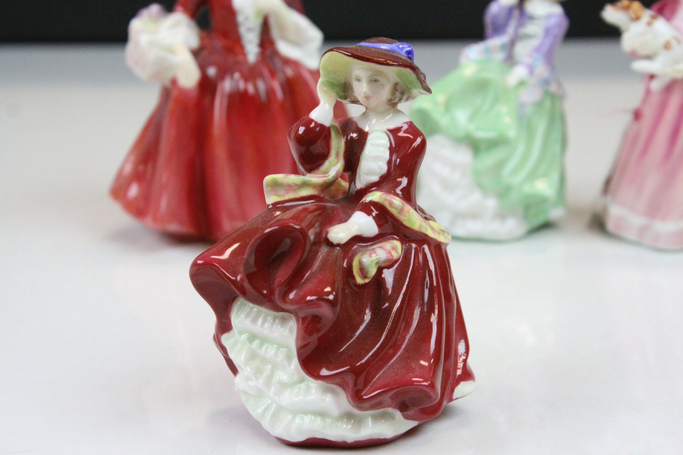 Four Royal Doulton ceramic figurines to include; Lavinia HN1955, Top O' the Hill HN3499, My First - Image 2 of 9