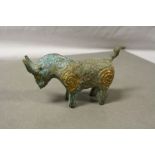 A bronze metal figure of a bull