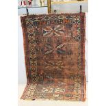 Eastern Red Ground Wool Rug with Stylised Pattern, 172cms x 110cms