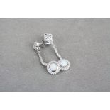 Pair of silver CZ and opal paneled drop earrings