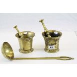 Two brass mortars with unassociated brass pestle, together with a large brass ladle (3)