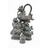 Six Asian Bronze Opium weights in graduating sizes, largest approx 12.5cm in height and all modelled