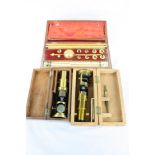 Two Wooden cased Brass Student type Microscopes plus a cased Sikes Hydrometer with slide rule &