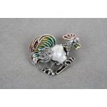 Unusual silver cockerel brooch made up of a pearl body and plique a jour decoration