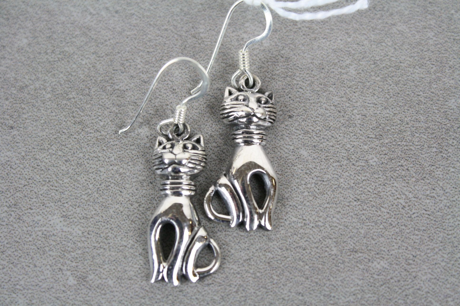 Pair of silver cat style earrings