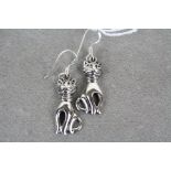 Pair of silver cat style earrings