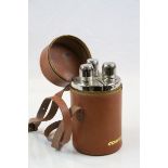 Leather cased set of three spirit flasks