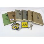 Two AA car badges, together with AA books to include Foreign touring guide, Members' Handbook. Hotel