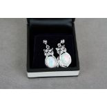 Pair of silver CZ and opal earrings of cat form
