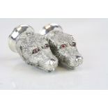 Pair of Condiments in the form of Dog's heads with Ruby coloured eyes, each approx 6cm tall