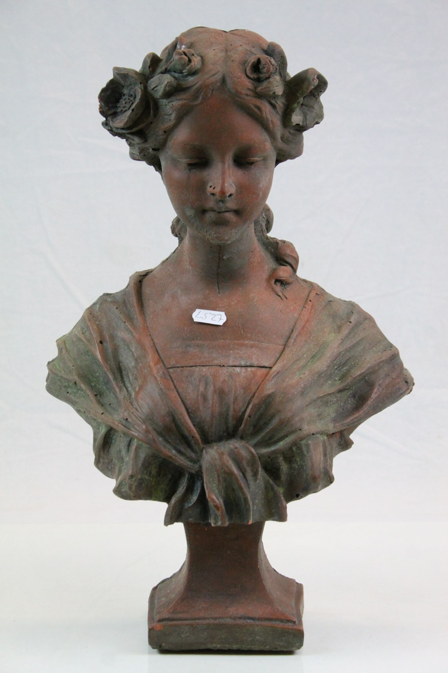 Composite stone bust of an art nouveau lady with flowers in her hair
