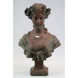 Composite stone bust of an art nouveau lady with flowers in her hair