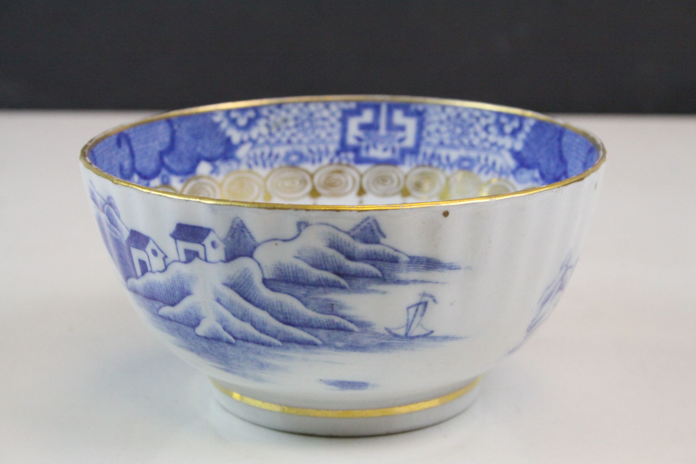 Oriental bowl with gold gilt rim and border in blue & white